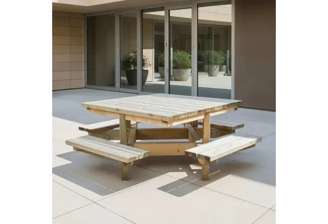 Table pique-nique carrée en bois devant un bâtiment Table pique-nique carrée en bois devant un bâtiment